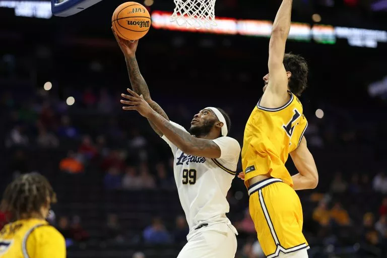 Rob Dockery looks to lead the Explorers over the Rams